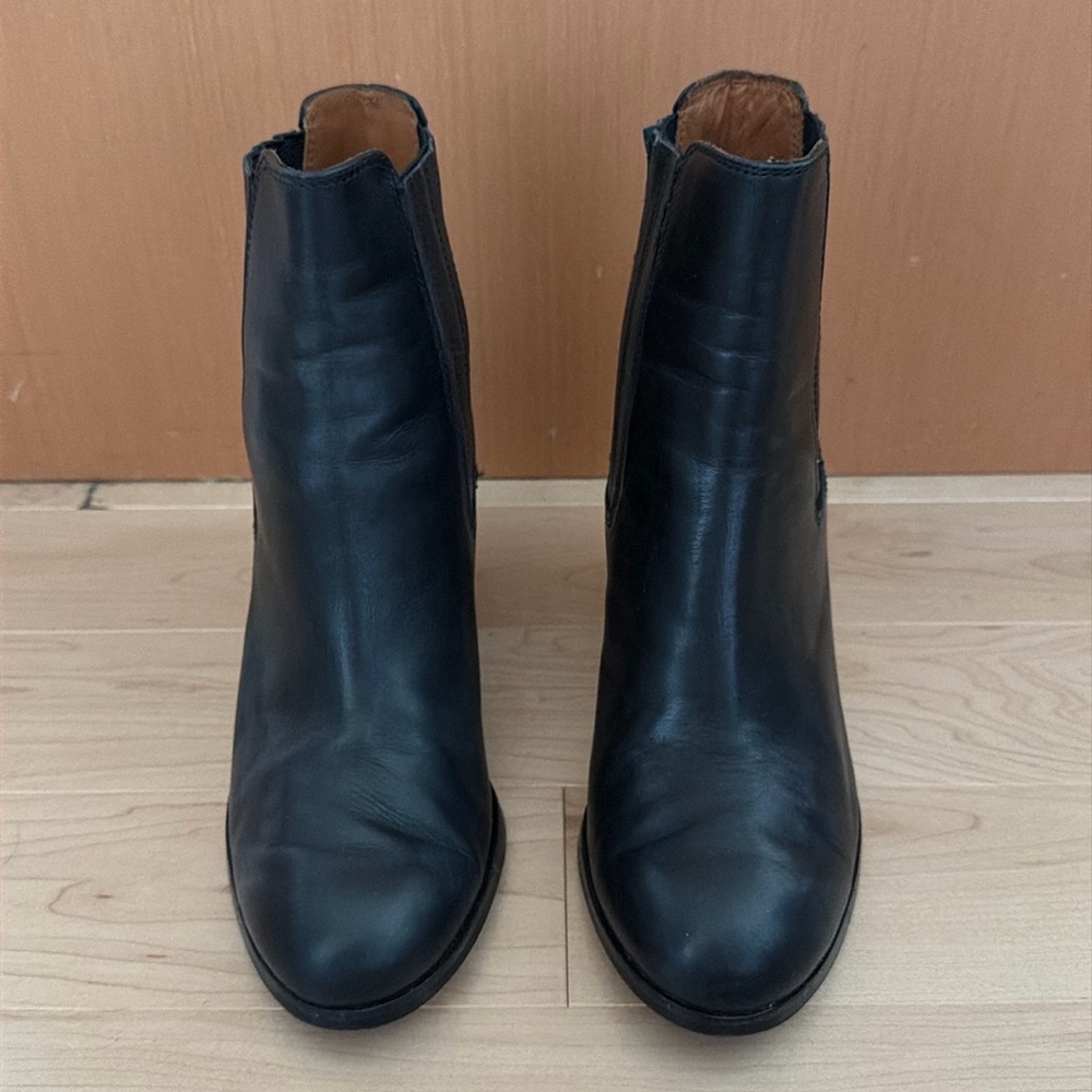 Black round toe heeled boots with elastic slip on